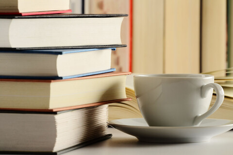 9367162 - composition with books and cup of coffee on the table